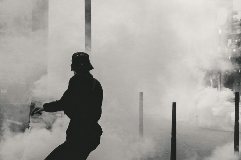 man standing near smoke